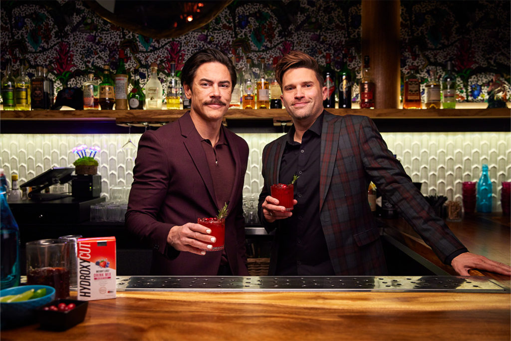 Tom Sandoval and Tom Schwartz holding Hydroxycut Drink Mix mocktails